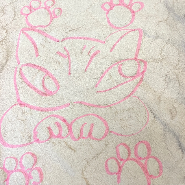 猫のダヤンのひざ掛けダヤン柄アイボリー色の絵柄の画像