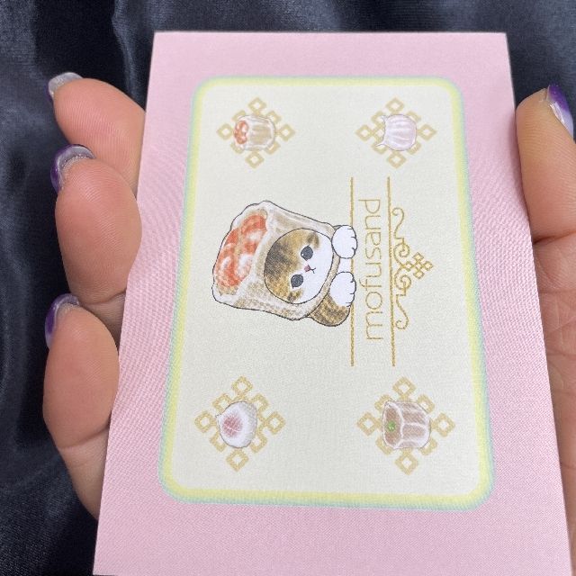 サンスター文具のmofusandのミニレターセット点心柄の封筒を手に持った画像