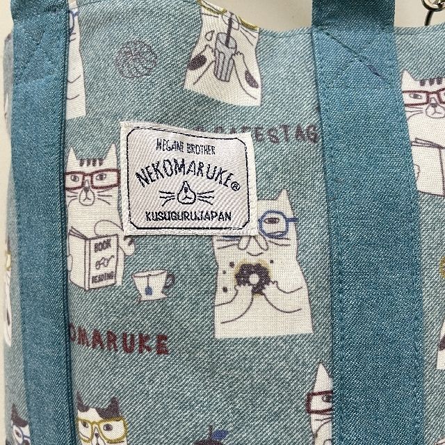 クスグルジャパンのネコまるけ楕円底バッグの絵柄の画像